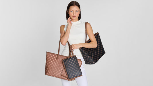 Model carrying a brown and black Svala Vita Tote vegan work and travel bag